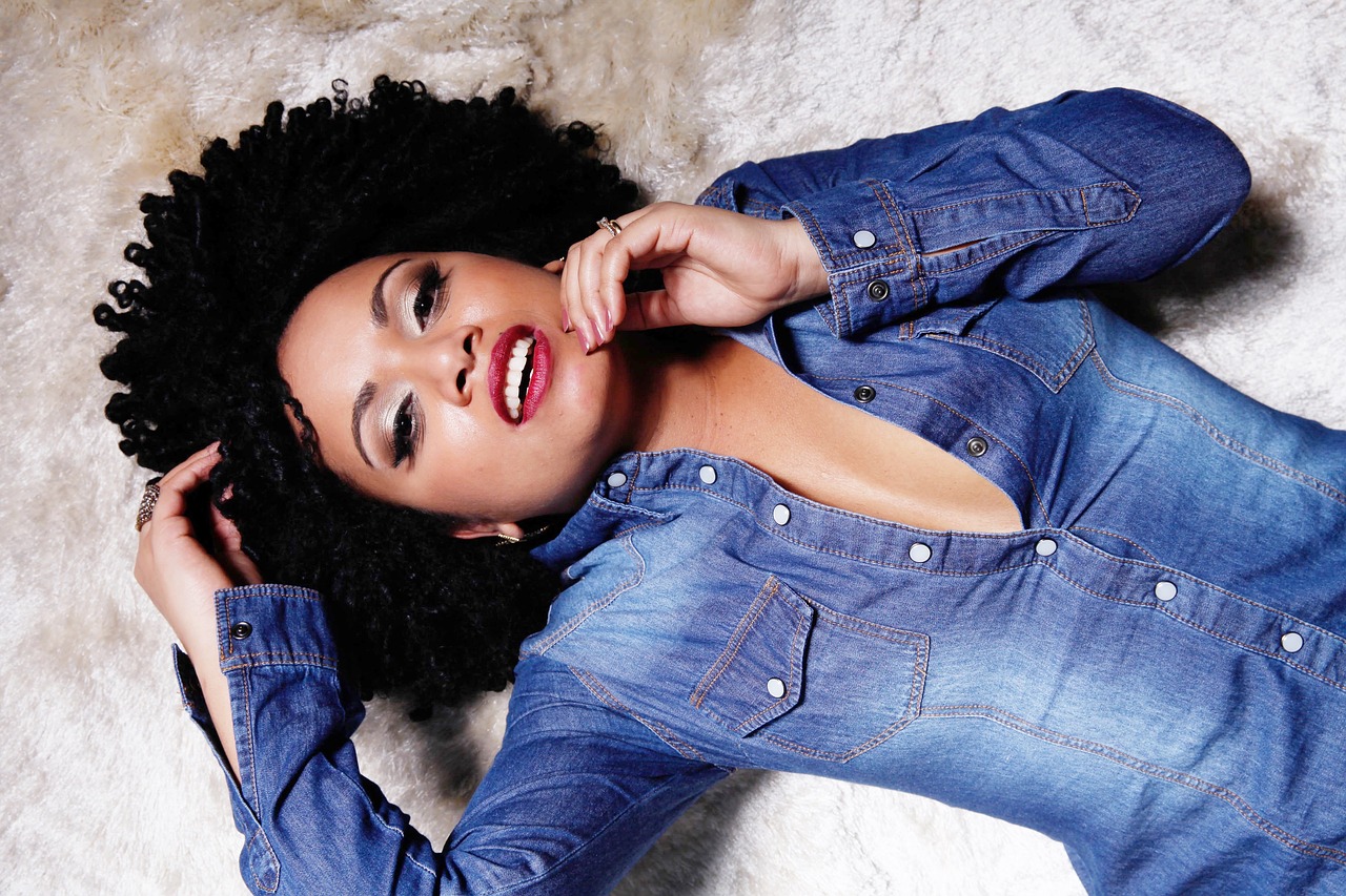 black woman lying on the ground with a seductive look